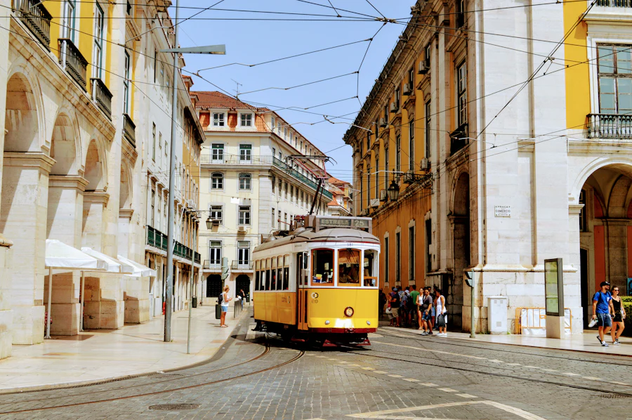 A yellow tram in a Lisbon street